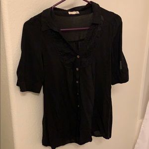 A black laced blouse.